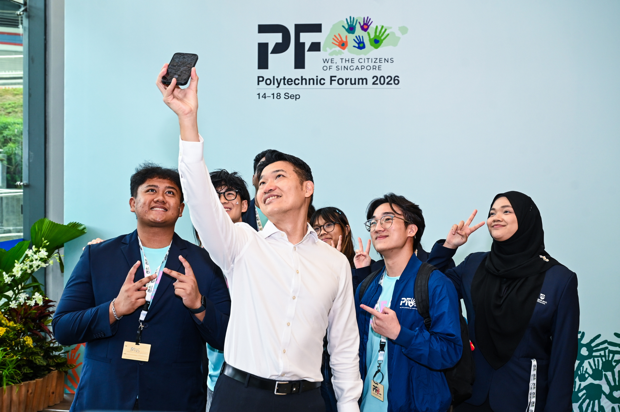 Student leaders gathering with Minister David Neo for a wefie following the Opening Ceremony.